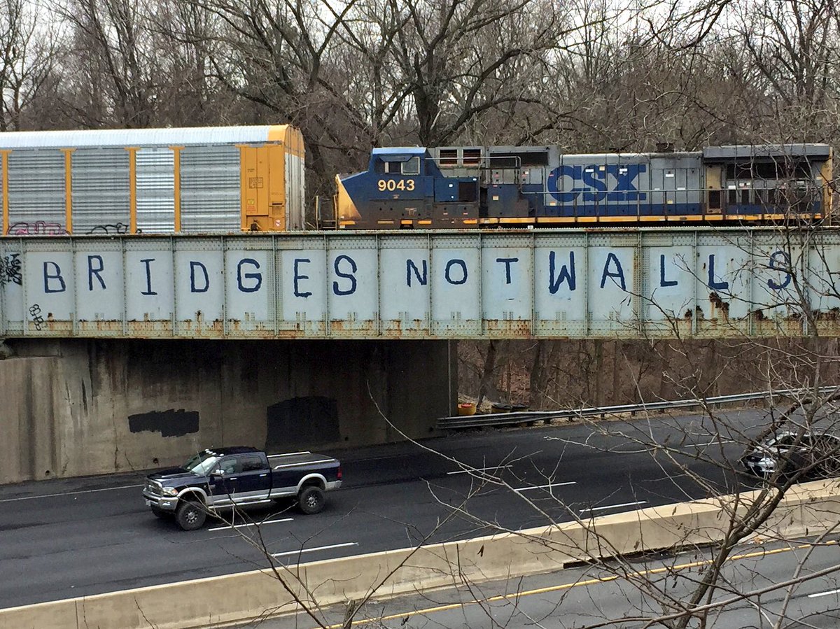 KevinLewisNomad's tweet photo. Message reads: "Bridges Not Walls" - I just spoke with man who said he supports freedom of speech, but doesn't condone illegal vandalism. https://t.co/VDKCjCzKD6
