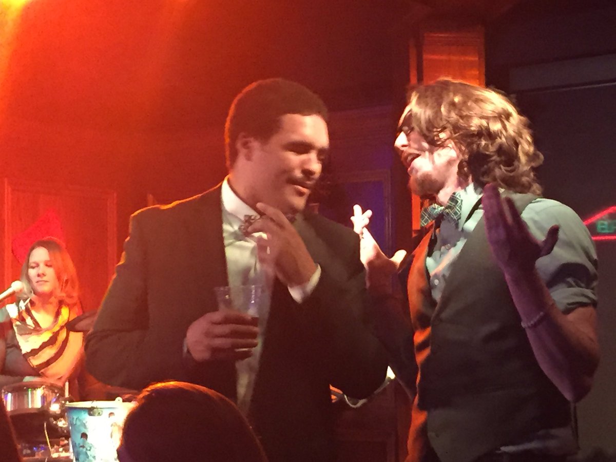 DoesItTequila's tweet photo. Rob explains to a random bar patron the importance of proper bowtie etiquette. #TBT https://t.co/mNhbJzcCsB