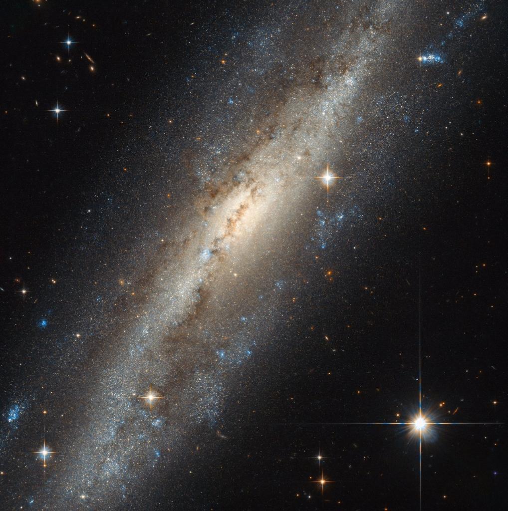 NASA's tweet photo. This spiral galaxy shows evidence of past interaction, such as two or more colliding &amp; merging into a bigger galaxy: https://t.co/qTBNEdKWvi https://t.co/yb2zs0KJwB