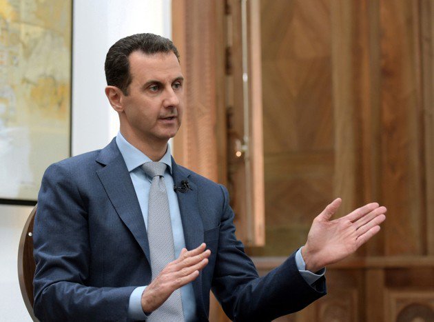 TheAtlantic's tweet photo. Syria's Assad calls mass-execution allegations 'fake news,' @YasmeenSerhan reports https://t.co/qSZQjOAII6 https://t.co/yO4xIeYezd