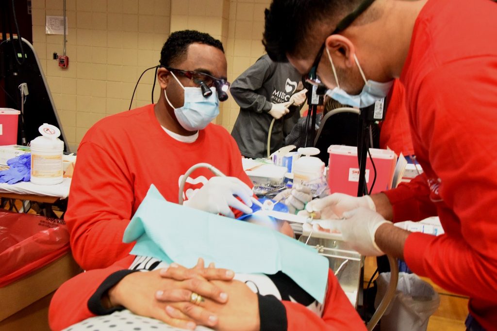 uthsc's tweet photo. Joining volunteers today at @bellevuememphis to bring free dental services to the #MidSouth at #MidMom. #UTHSC https://t.co/tXTnZCpiSD https://t.co/xLnuceYfzx