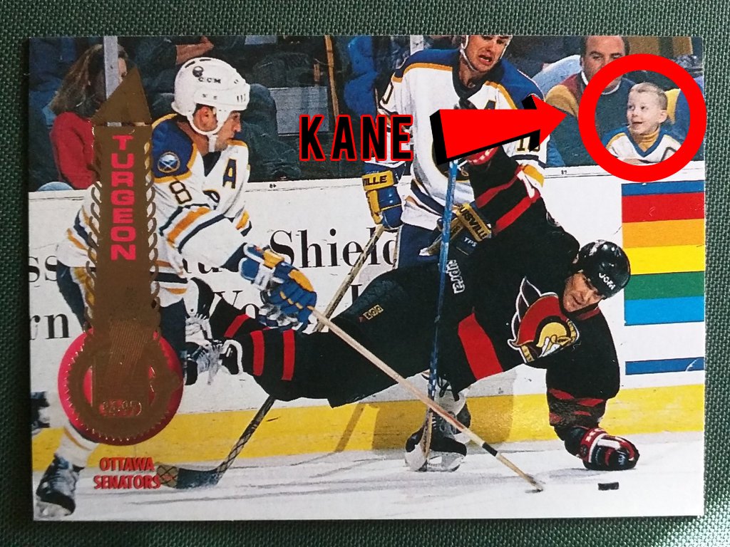 theScore's tweet photo. Patrick Kane matches Sylvain Turgeon in career goals, whose hockey card he photobombed as a kid. 👀 https://t.co/IbDXS2yHLD https://t.co/bjNtggond8