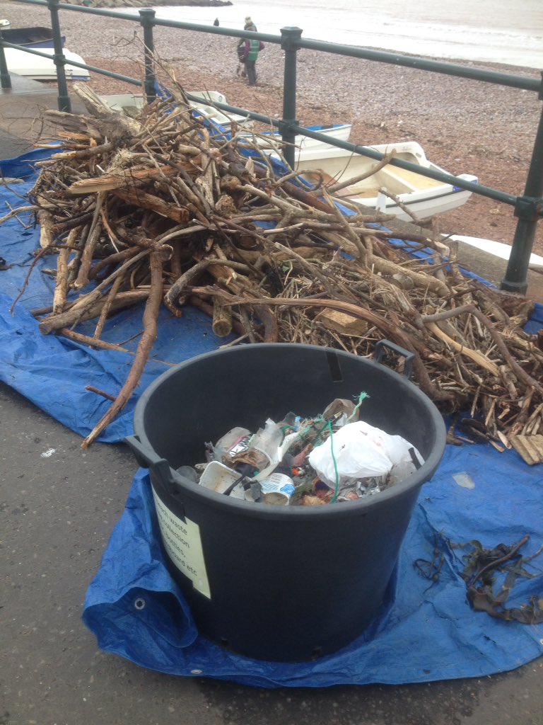 Wildlife247's tweet photo. Great effort today by beach cleaners from Sidmouth In Bloom clearing detritus washed up, loads of #driftwood, #fishing gear and #litter :( https://t.co/83qFlBDyW1