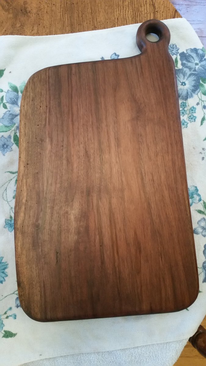 A solid slab live edge black walnut cutting board just finished!