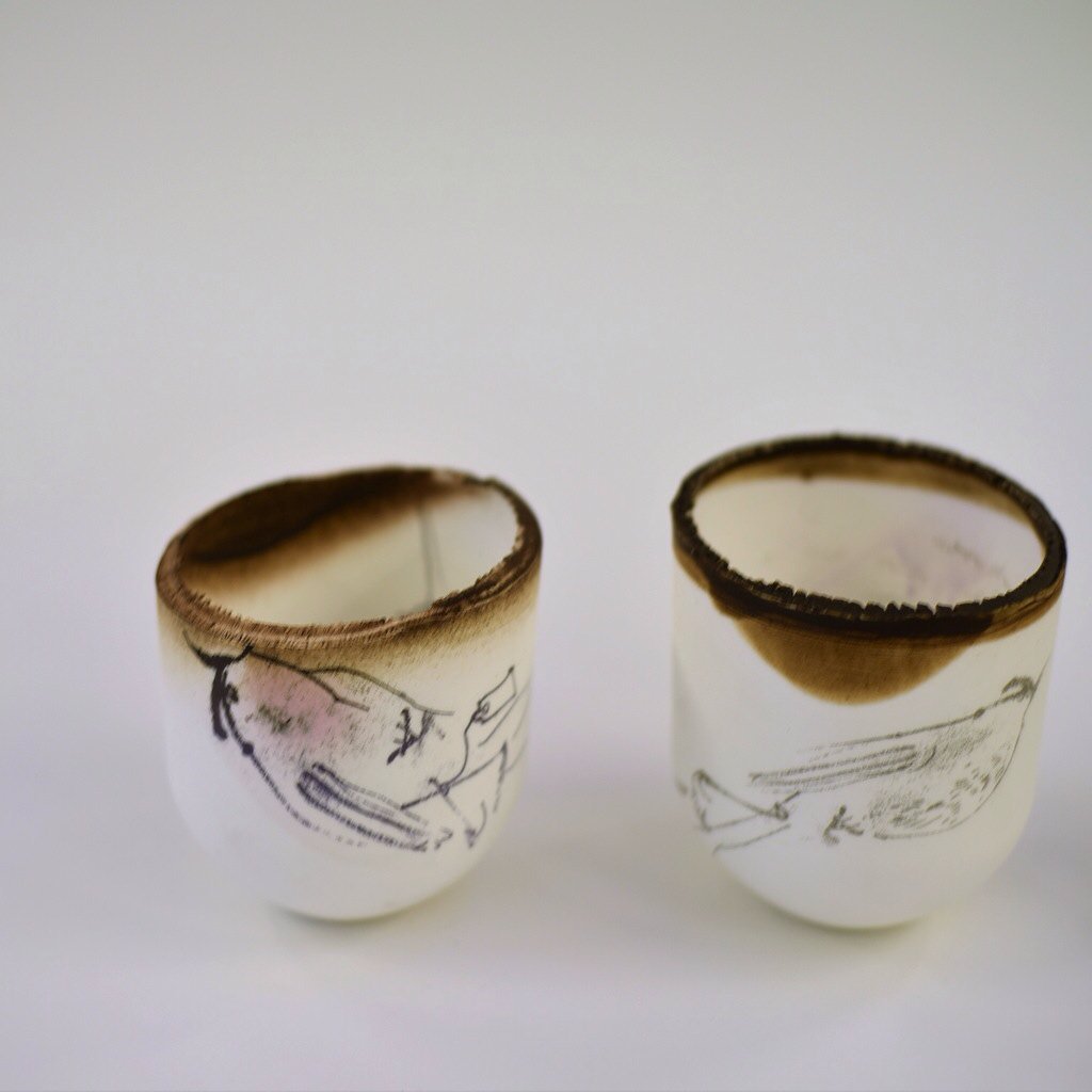 Bone china cups with sprayed bird plumage. #manchestercraftanddesign#snuggallery