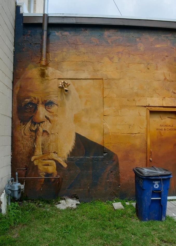 #DarwinDay ... I was able to find this terrific #CharlesDarwin #StreetArt in #Houston located behind a commercial strip center.