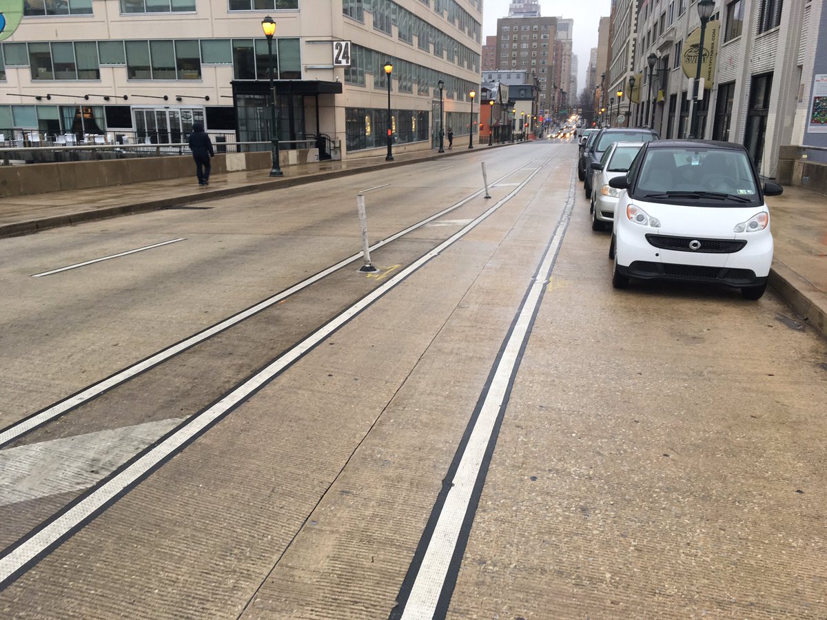 alexschief's tweet photo. Philly's once vaunted six-bollard-protected-bike-lane now down to two. https://t.co/4gOXOSwEbM