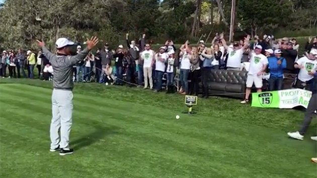 WATCH the crowd belt out to as he tees off  