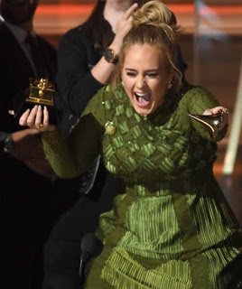Photogist: That Moment Adele Broke Her Grammy Award In Half For Beyonce