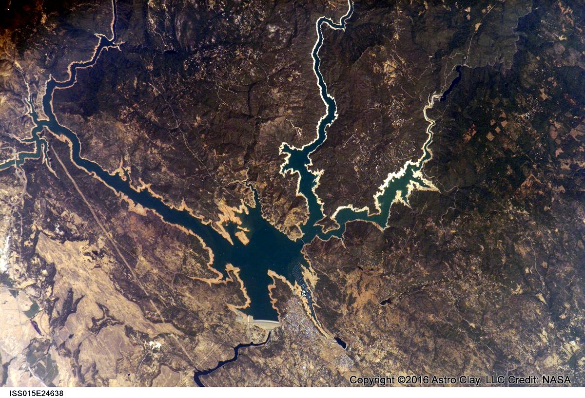 Astro_Clay's tweet photo. @ABC Spillway --and route water takes back to the river-- visible in this shot I took from space in 2007. #ISSExp15 Thanks @PC0101 https://t.co/t5Gg23UVZu