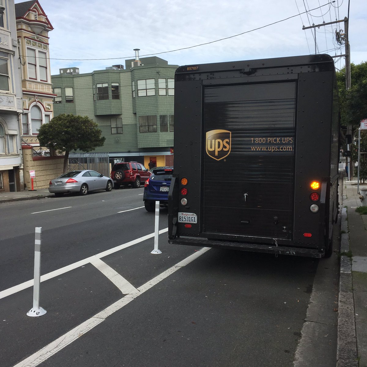 mddove's tweet photo. Those soft hit posts aren't placed along the bike lane to protect your truck, @UPS @rideshaming @sfbike @SFMTrA #parkingdirtysf https://t.co/r1CnhnmwBo