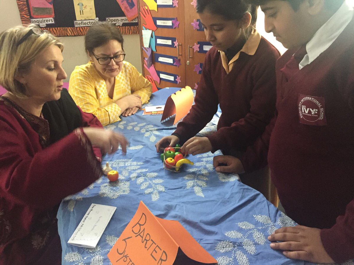 st_werburghs's tweet photo. Ms Banks being taught how to make decisions on the use of money and to 'barter' #usefulskill @pkBritish @Schools_On_Line @BritishCouncil https://t.co/PalHlrffES
