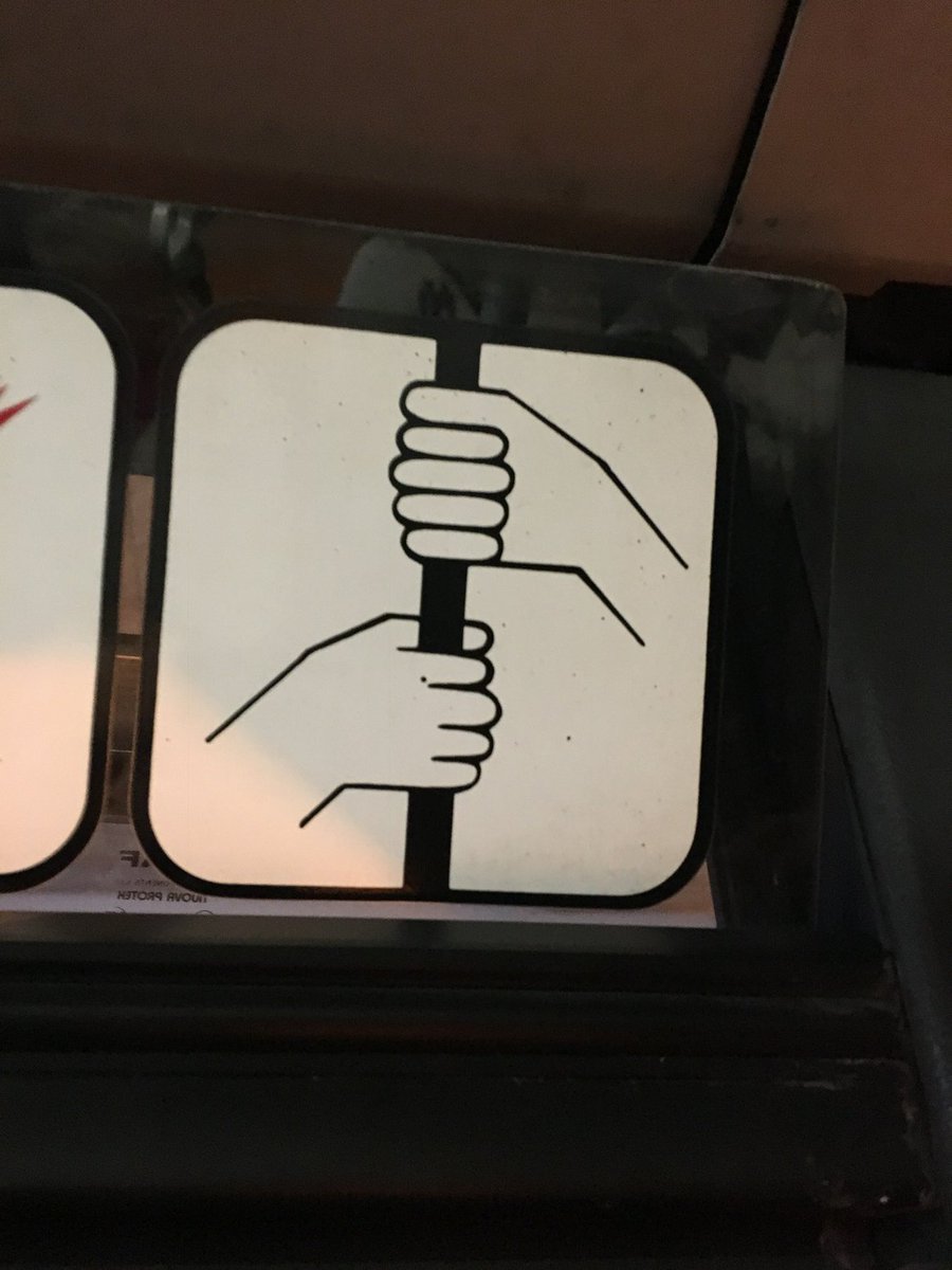I really, really tried to obey this Portuguese bus safety sign, but my left hand just wasn't quite up the job...