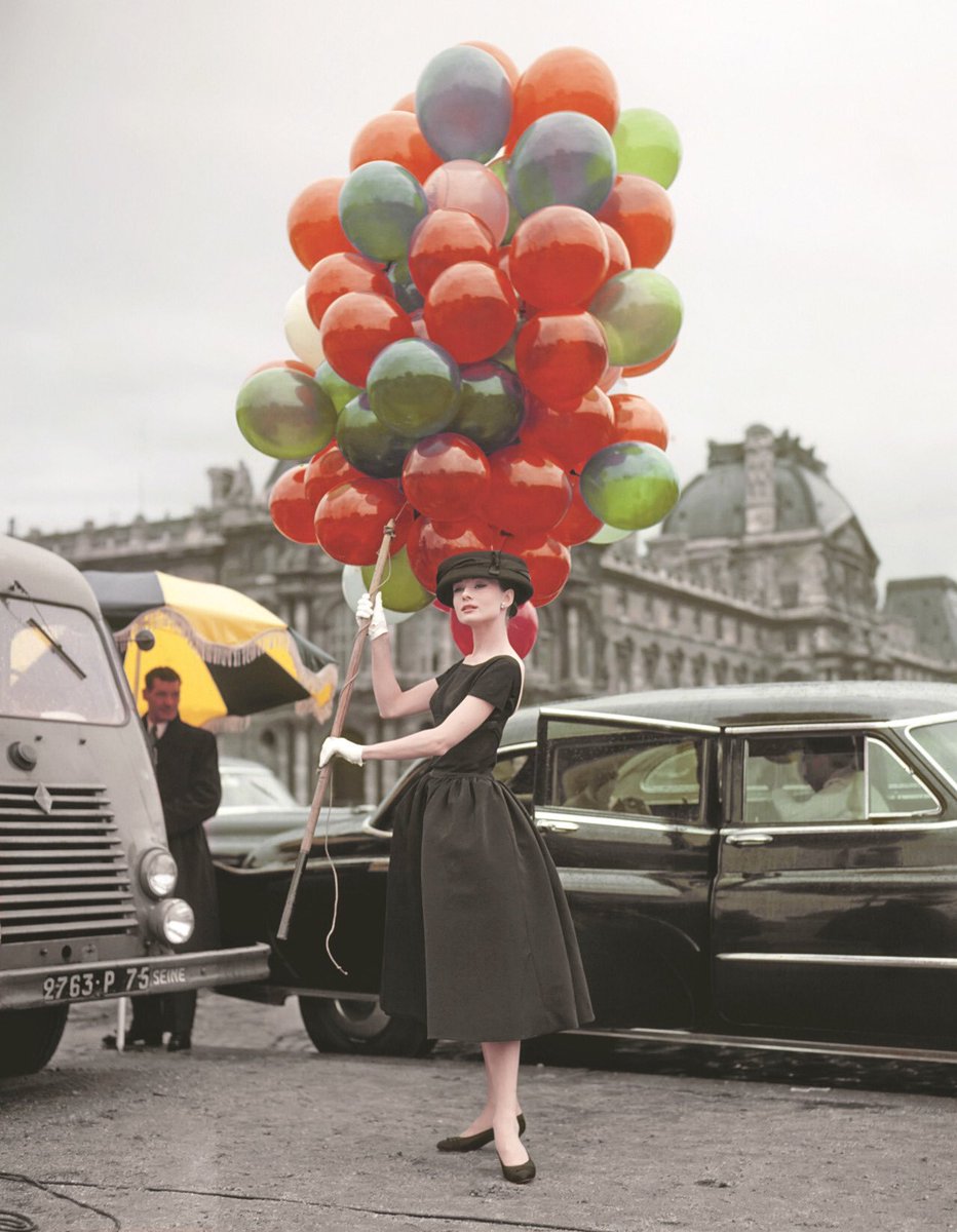 Audrey Hepburn with all of the balloons, France, 1957. #OldSchoolCool