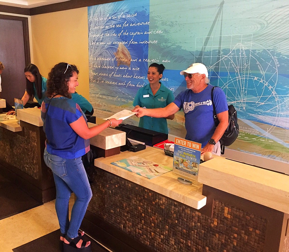 jimmybuffett's tweet image. Thank you come again.  (JB checking guests out at Margaritaville Resort &amp;amp; Marina in Key West)