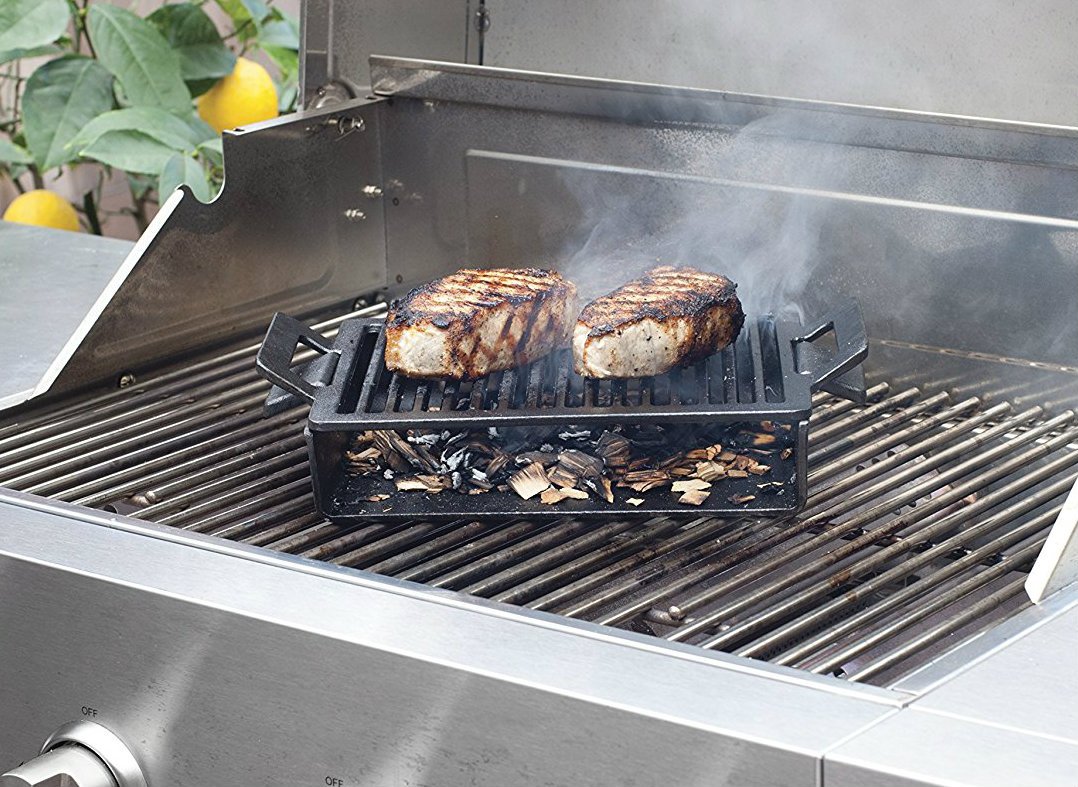 It's a plancha, cast iron grate, smoker, and humidifier all in one: goo.gl/Uk29Oi #BBQ <a href="/BestOfBarbecue/">BestOfBarbecue</a>