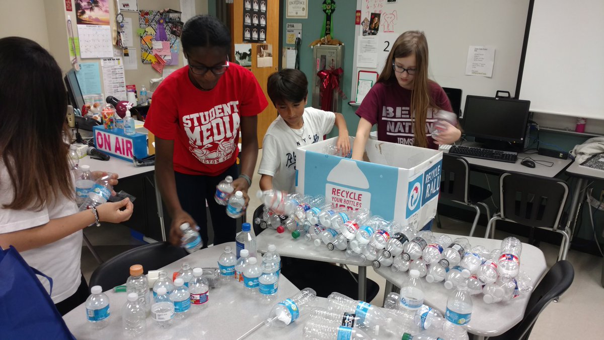 StuCo working on the recycle pyramid #pepsicorecycling #takecareofEARTH