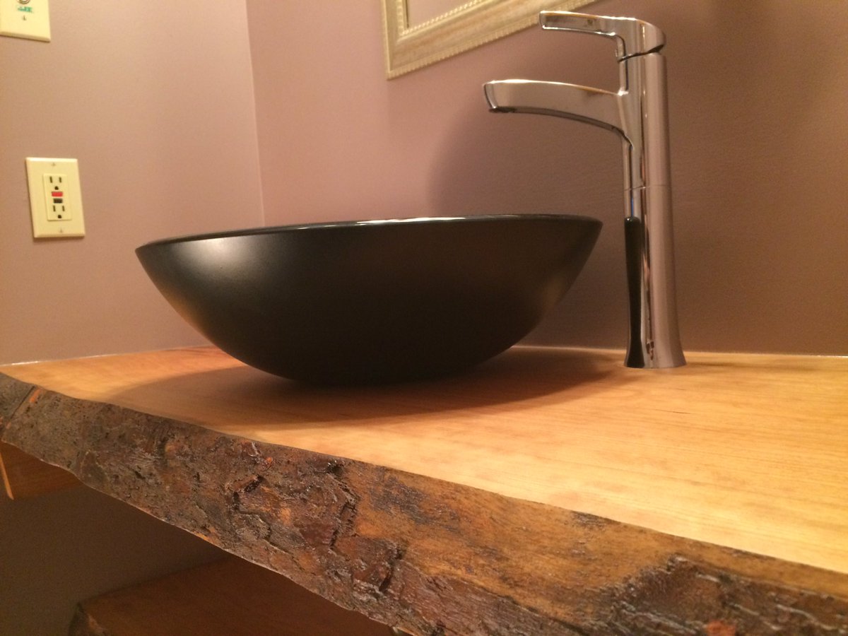 Before and after pictures of 2" thick live edge cherry counter, with glass vessel and bottom shelf.