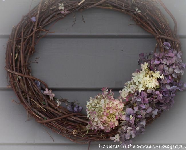 MomentsintheG's tweet photo. I can't believe that it is snowing again as I place my dried hydrangea wreath by the front door.
#stillsnowing #driedhydrangea https://t.co/WaPqpdSObF