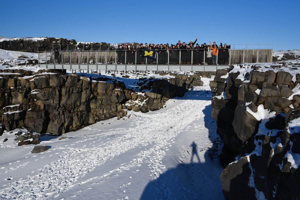 HoffmanAndy's tweet photo. @MichiganRoss students on the bridge between the NA and EU continents in Iceland with #RossGlobal, photo credit @abrox13 @GlobalMichigan https://t.co/jul6DHryxq
