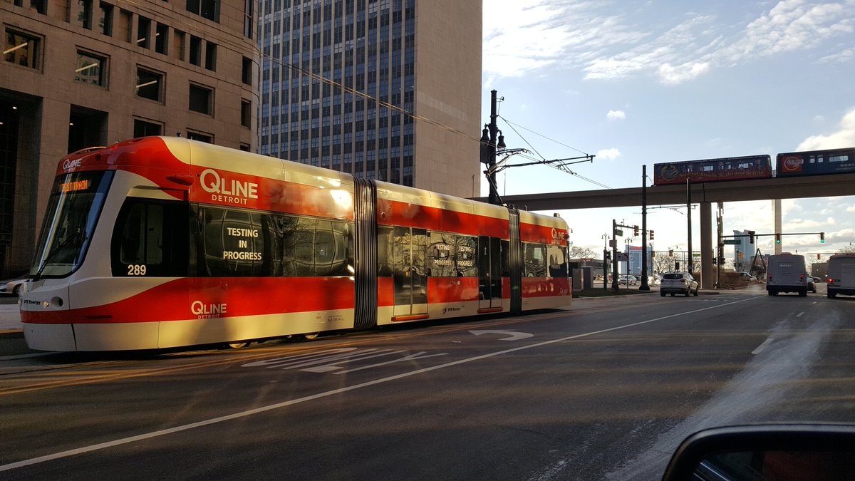 reportermikec's tweet photo. Get used to it: Q-Line trains will be regulars on Woodward in downtown Detroit. Today was aest run, with the People Mover overhead. @WWJ950 https://t.co/28IA5jepbb