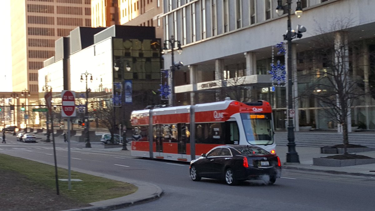 reportermikec's tweet photo. Get used to it: Q-Line trains will be regulars on Woodward in downtown Detroit. Today was aest run, with the People Mover overhead. @WWJ950 https://t.co/28IA5jepbb