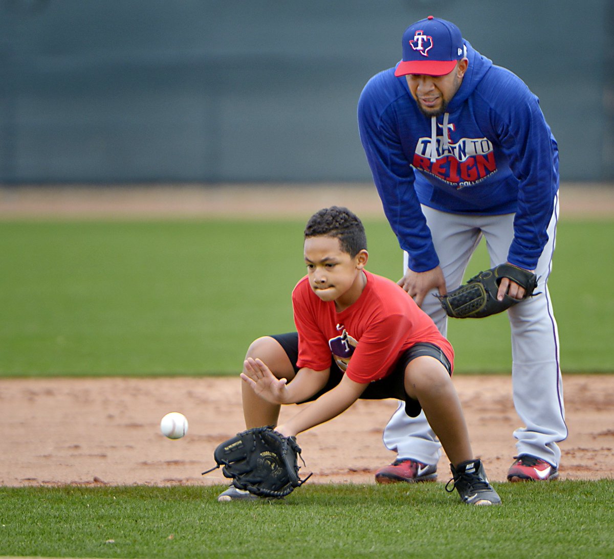 Max Faulkner on X: #Rangers shortstop Elvis Andrus teaches third baseman Adrian  Beltre's son AJ how to field grounders at Rangers spring training.   / X