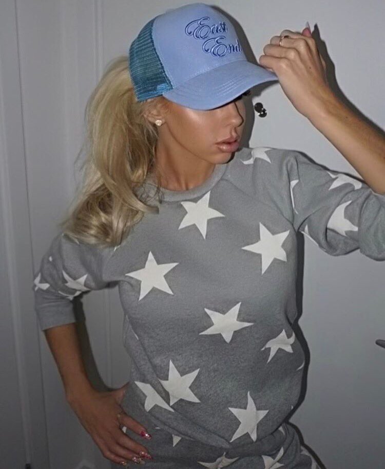 eastendltd's tweet photo. @hannahelizinsta looking sick in her BABY BLUE ILLUMINATI hat ! Get yours 🐾https://t.co/nyHfRPnCRz 🐾 https://t.co/vnJ8PFUkWi