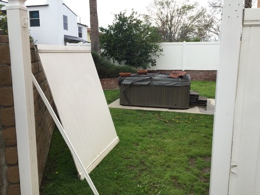 Storm damage hits home. Wind rips off gate on south side of our house #LAweather