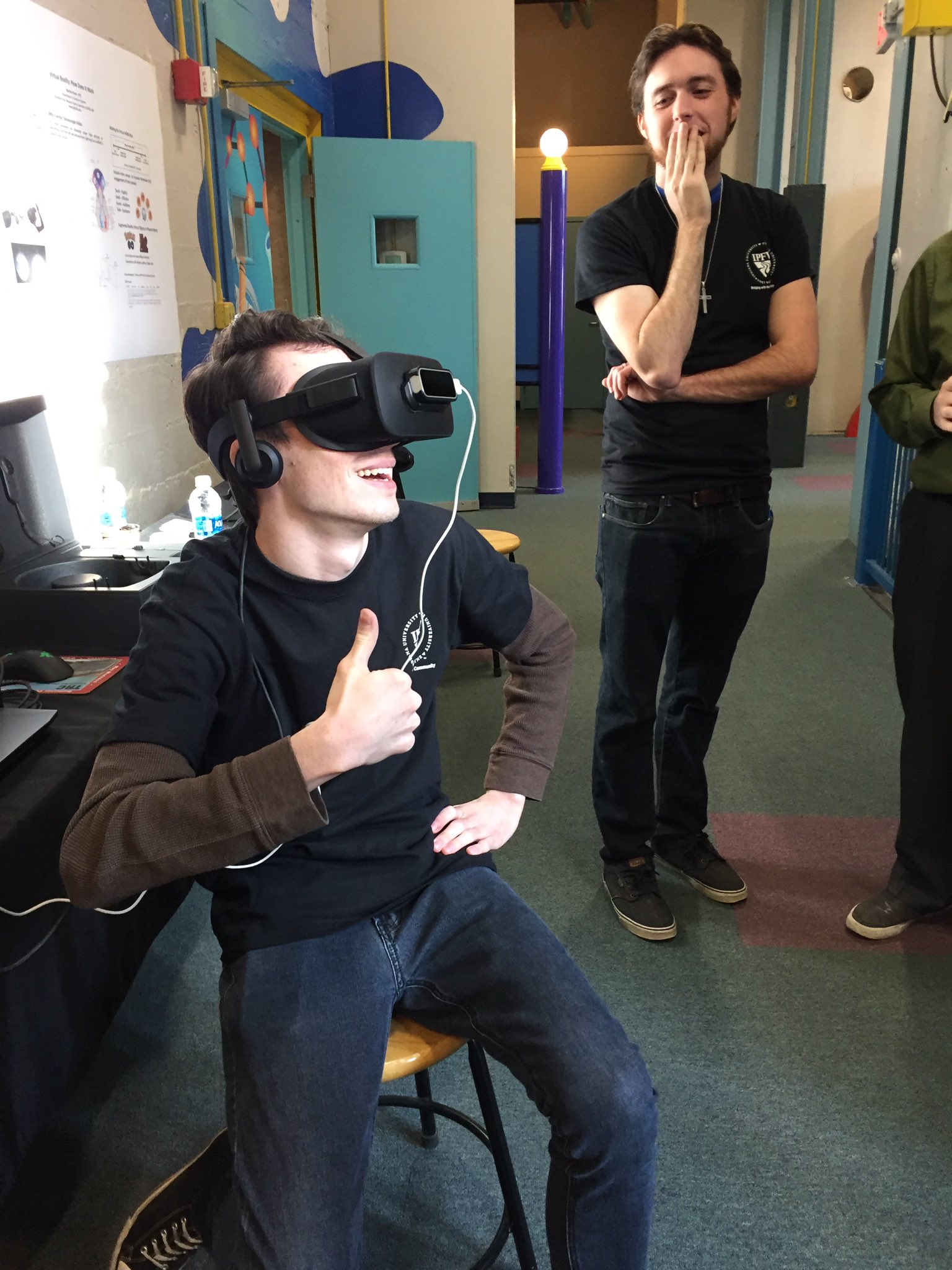 Male student excitedly engaging with VR
