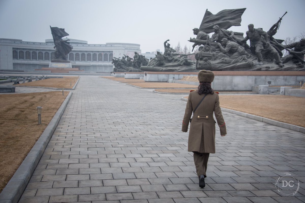 From my recent trip to Pyongyang, North Korea. A DPRK People's Army soldier walks us to The Victorious Fatherland Liberation War Museum.