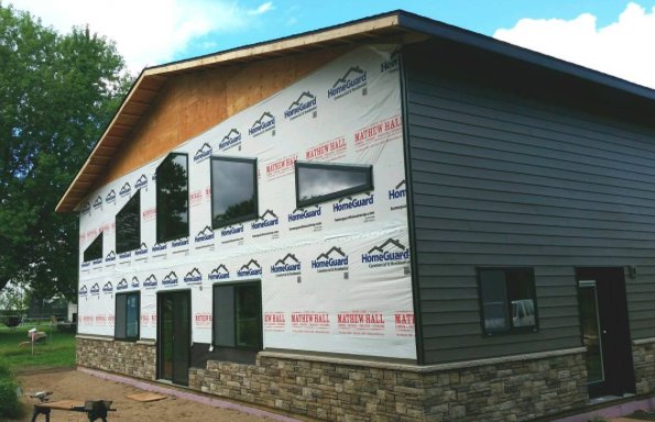 NFBAframebuild's tweet photo. Check out this custom post-frame home from Structural Buildings! We love the Versetta Stone facade! #PostFrameHomes #PostFrame https://t.co/2a3LQsSjmM