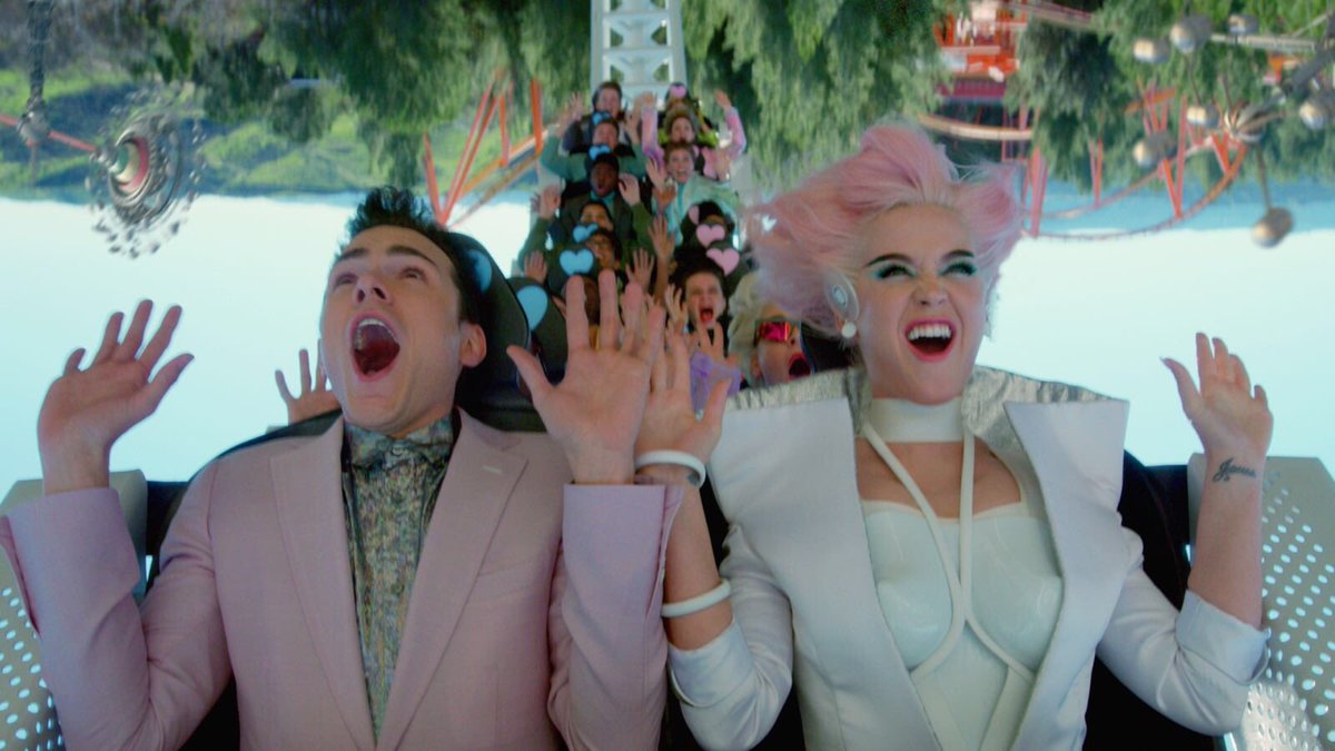 katyperry's tweet photo. WELCOME TO 🎢🎡🎠OBLIVIA🎠🎢🎡 WHERE EVERYTHING IS ALWAYS ROSY: https://t.co/X1vMe9s3zS   Directed by Mathew Cullen FT @SkipMarley #CTTRVIDEO 🥀 https://t.co/E6pJ0IztME