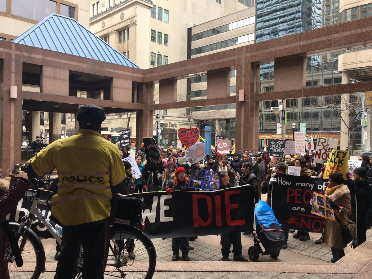 NoHarmToronto's tweet photo. We want your budget! Police are the arm of the drug war. Stop showing up at overdose 911 calls. Now. @JohnTory @TorontoPolice #lifewontwait https://t.co/yUoX0HXBJK