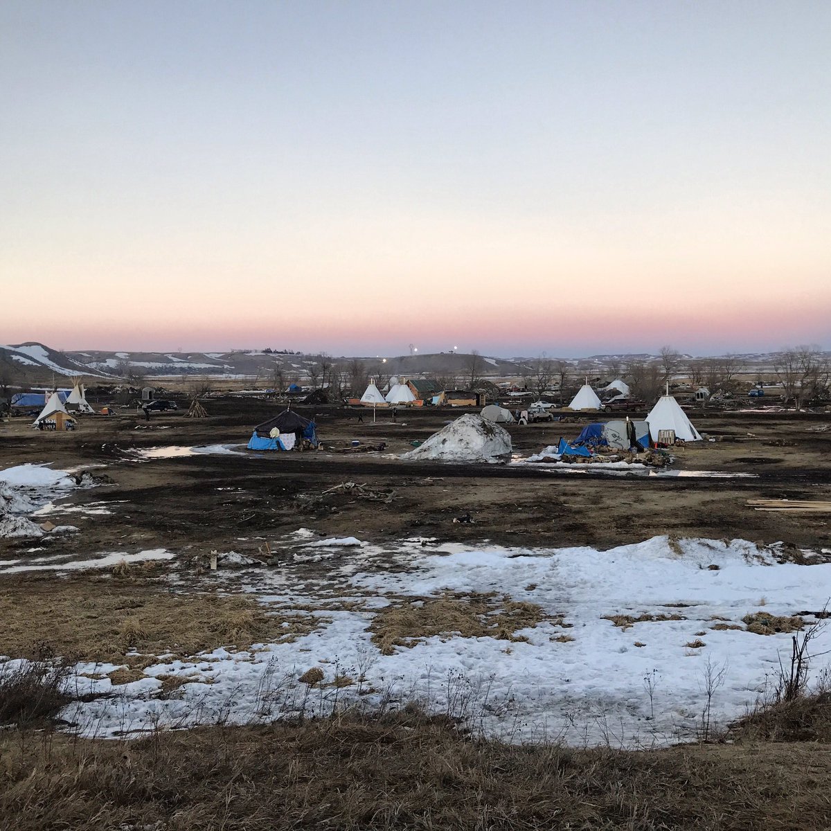 zhaabowekwe's tweet photo. We are surrounded by federal &amp; state law enforcement. Our spirits remain high. Indigenous peoples have not and will never be broken. #NoDAPL https://t.co/Nfpcrvwwkw