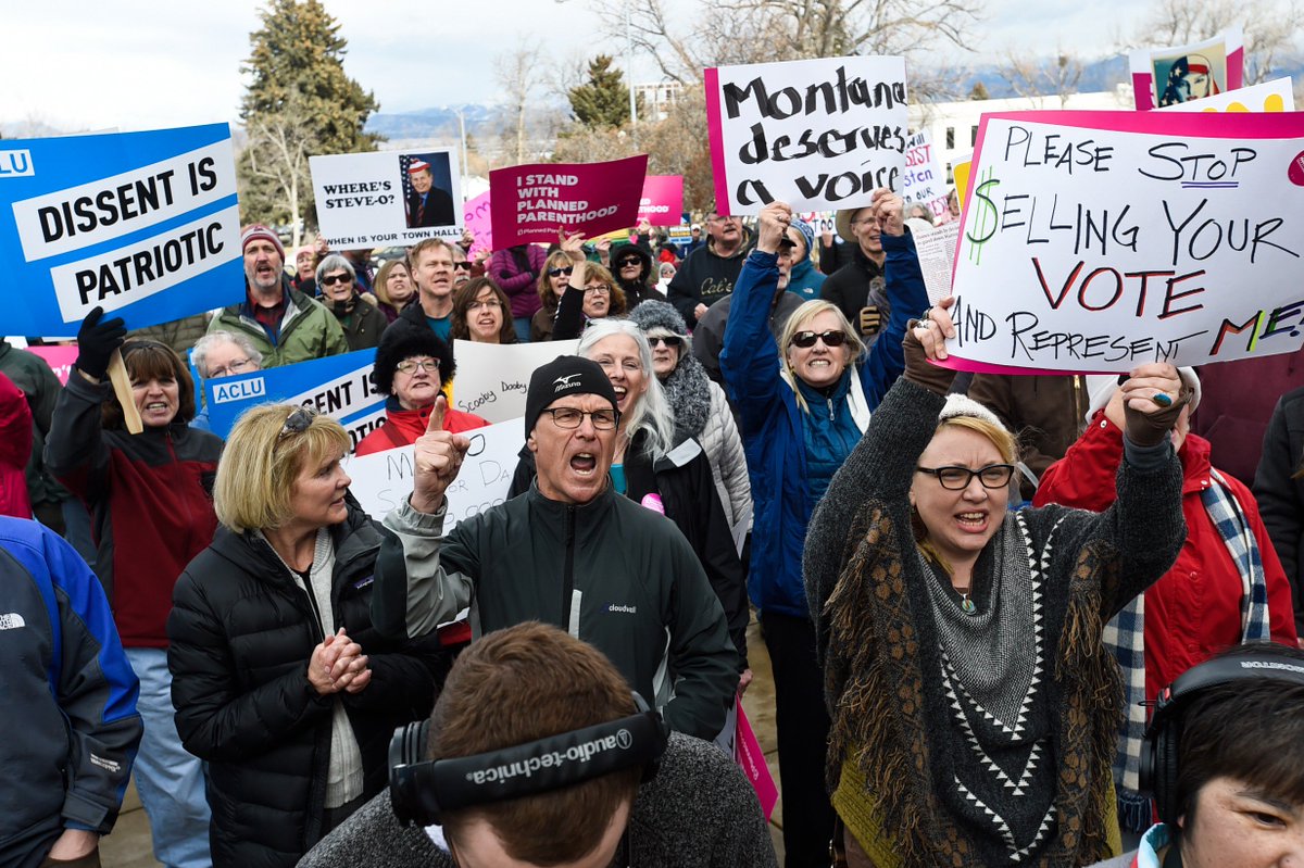 thom_g_bridge's tweet photo. PHOTOS: Hundreds of protesters gather to #BringtheTownHall to @SteveDaines who canceled his address: https://t.co/2CbYAnRhEY  #mtnews #mtpol https://t.co/CuJblpf6wk