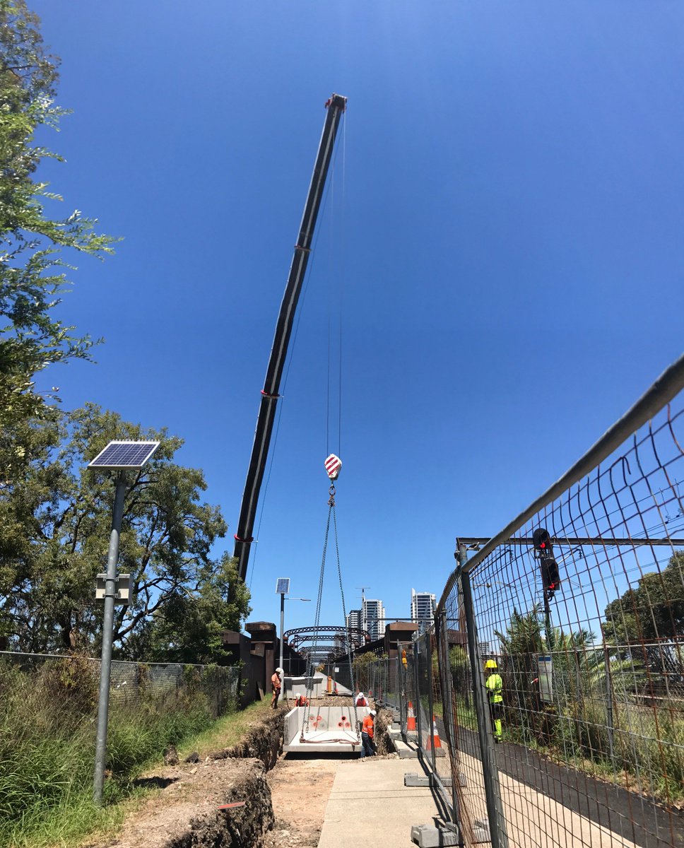 Ausgrid's tweet photo. Crews used a crane to lift joint bay over Old Meadowbank Rail Bridge as we replace old underground cables between #WentworthPoint & #TopRyde https://t.co/iUa6GxwhnG