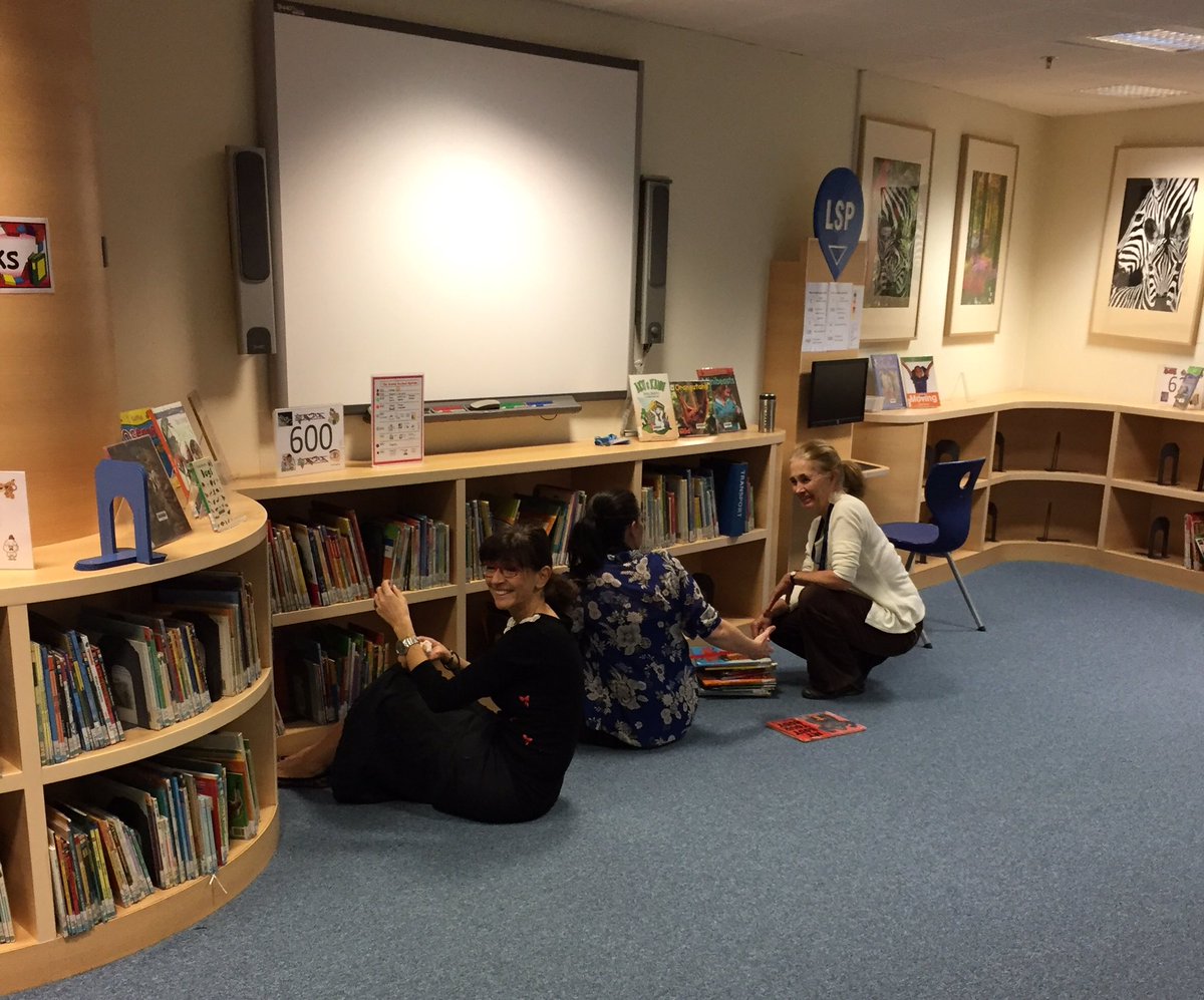 BSAKlibrary's tweet photo. Hard at work moving infant nonfiction. Ready to start hunt for Pokemon?! #BSAKlibrary https://t.co/XV8qEvKarK