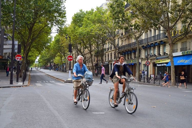 When you ride a bicycle, you're part of a neighborhood. 
When you're in a car, you're just passing through.