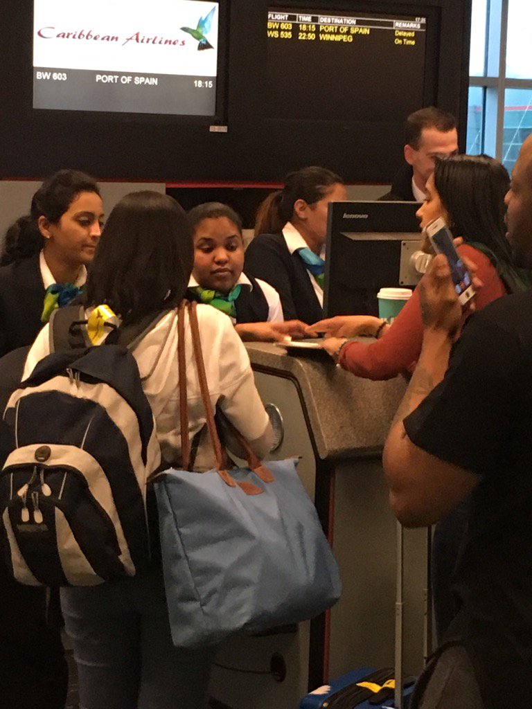 NishT6's tweet photo. @AirCaribbean Crew handing out a $5 voucher for a 9 hr wait!! Amazing!! profits before service! https://t.co/OmsrOOZ8Ip