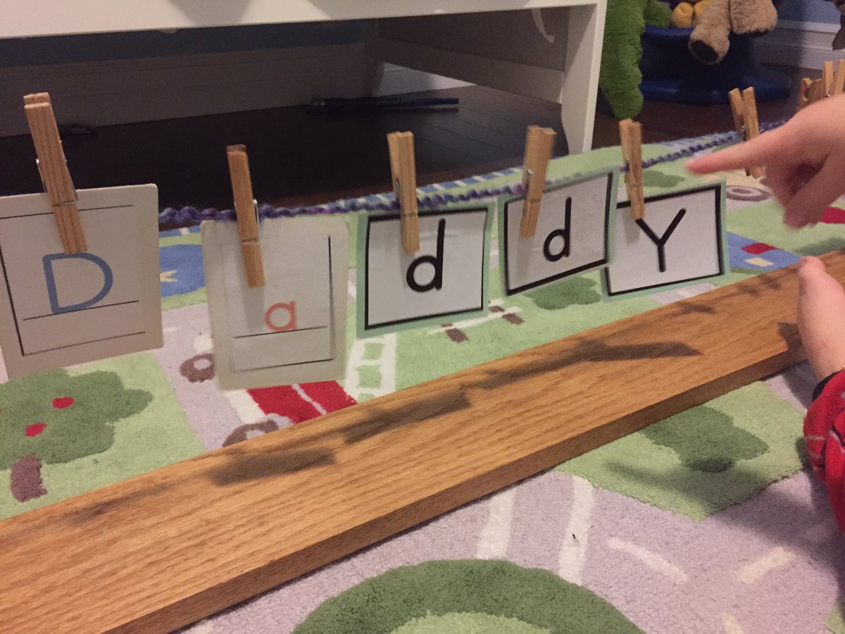 Clothesline writing with pictures and letter cards. We are practising alphabet recognition and spelling. It's #literacy and #finemotor too!