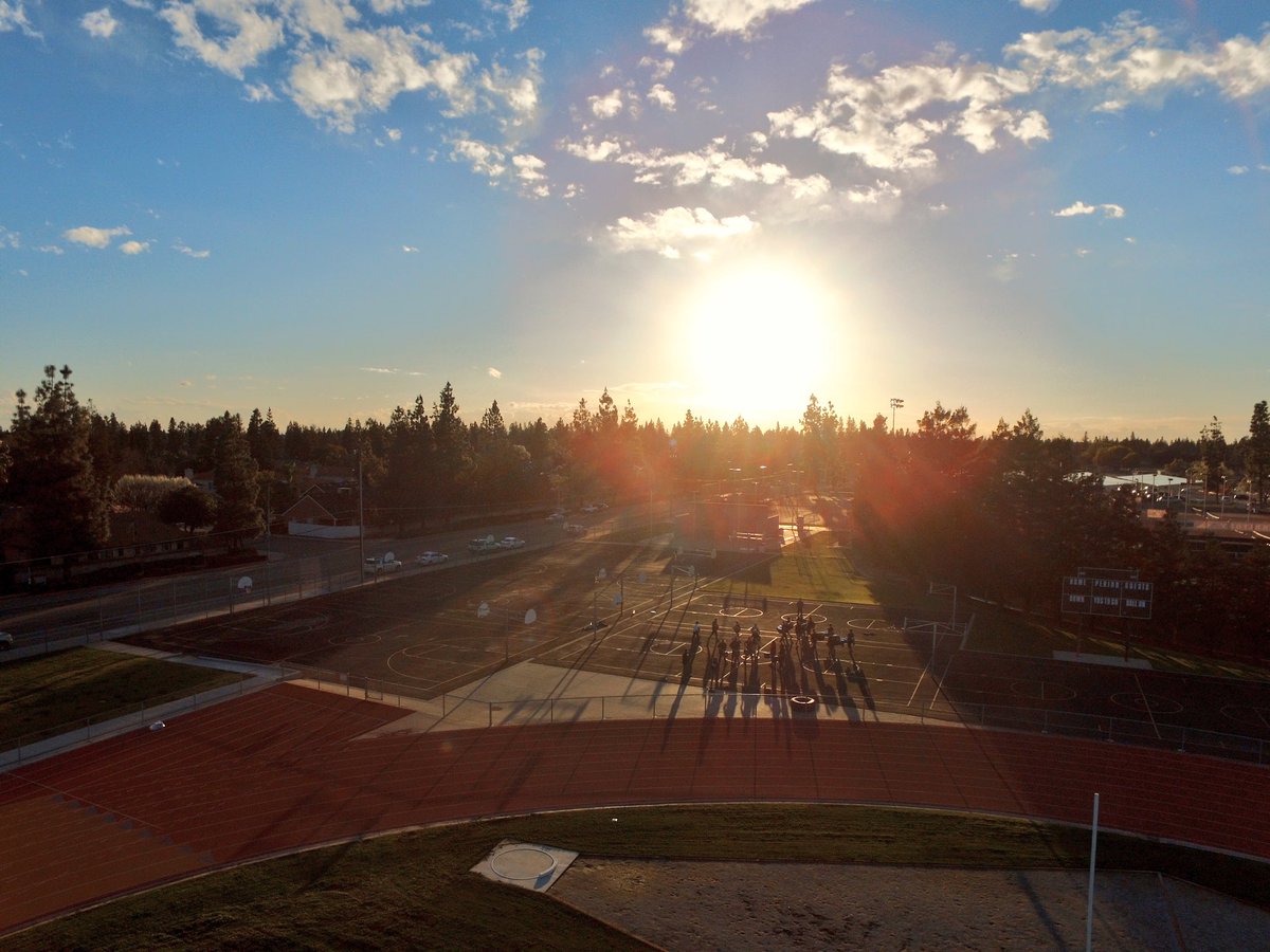 cloviswestmusic's tweet image. The drumline and cymbals rehearsing out on the blacktop today...caught by drone!