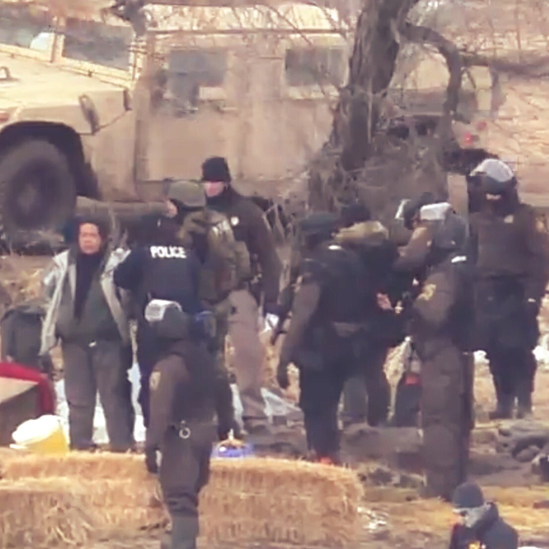 NoDAPL_'s tweet photo. Militarized police arrest elder holding up sacred pipe &amp; smash sweat lodge #NoDAPL #MniWiconi #WaterisLife  https://t.co/F2M1wi7ask