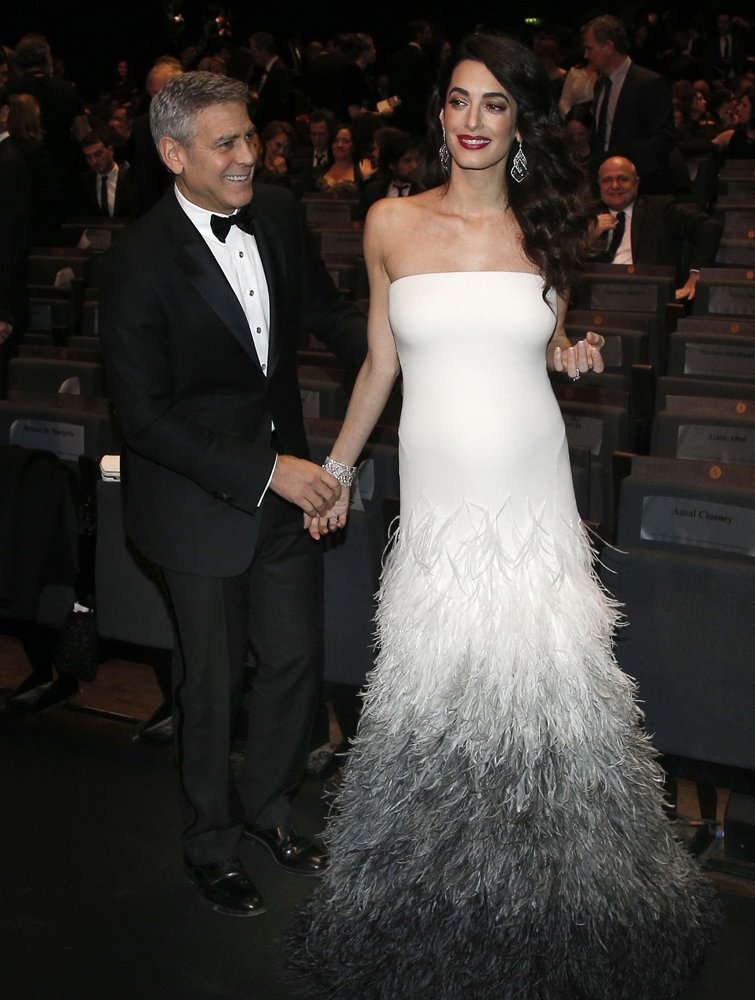 APEntertainment's tweet photo. PHOTO GALLERY: Honorary award recipient #GeorgeClooney and #AmalClooney step out at the 42nd #cesar2017 Film Awards in Paris. https://t.co/Hf6Z5Tx7xe