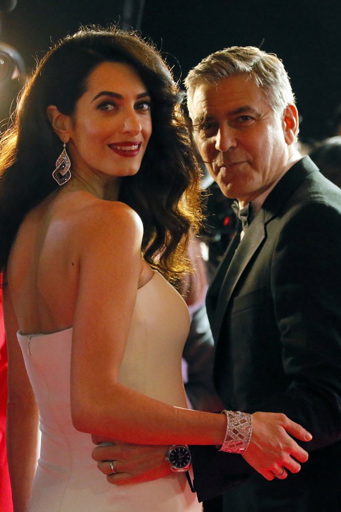 APEntertainment's tweet photo. PHOTO GALLERY: Honorary award recipient #GeorgeClooney and #AmalClooney step out at the 42nd #cesar2017 Film Awards in Paris. https://t.co/Hf6Z5Tx7xe