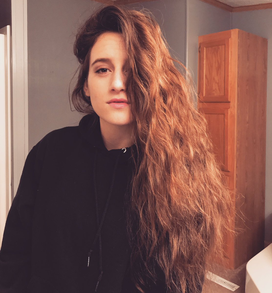 JuliahSerra's tweet photo. It's a long hair don't care, rain + braid mess, black hoodie, bathroom selfie, after workout highlight kind of night. 
#longhairdontcare https://t.co/RfggjlSTwx