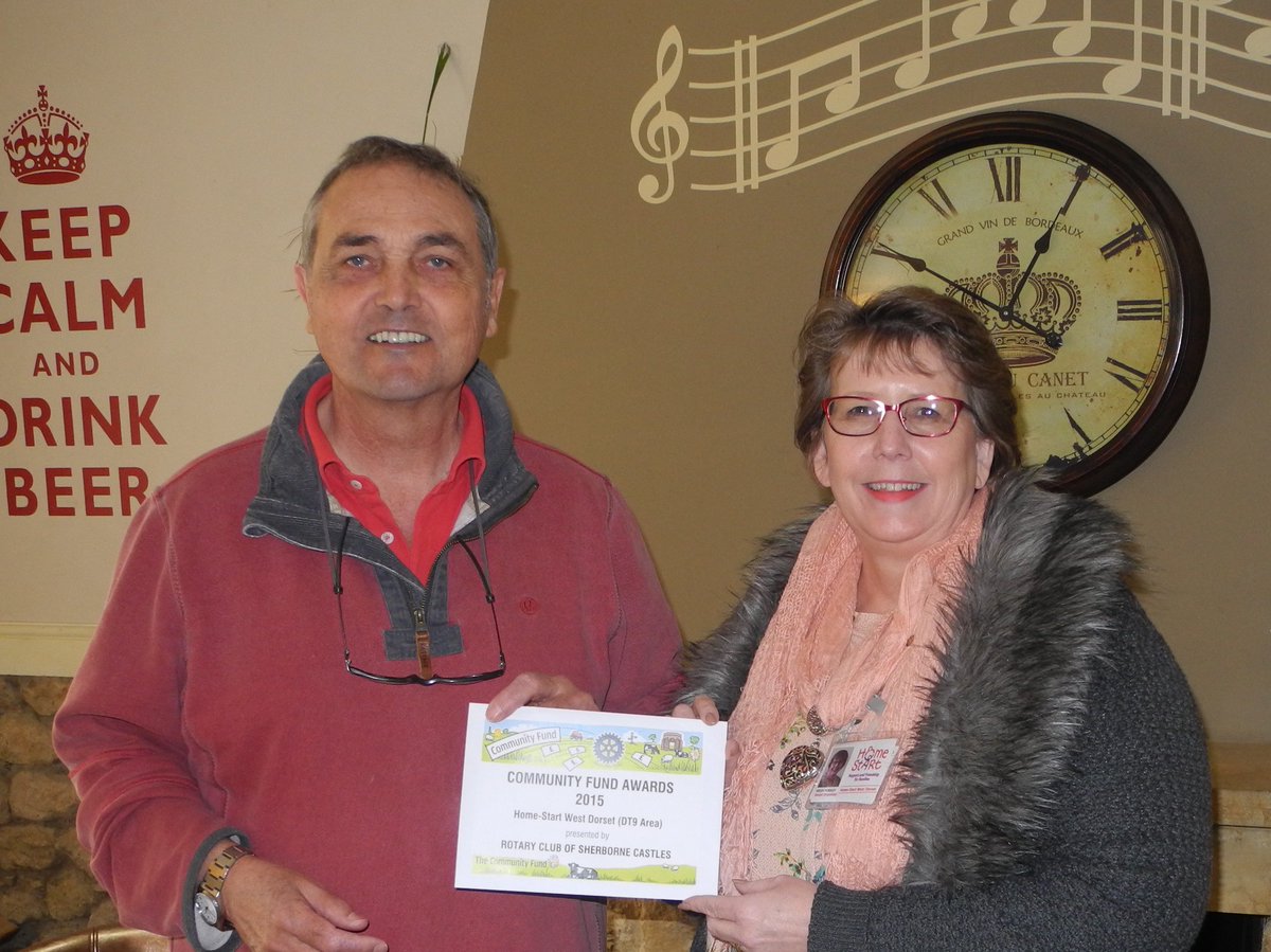 Chris MacAdie, Past President Rotary Club of Sherborne Castles present Helen Horsley, Senior Organiser Home-Start West Dorset with the award