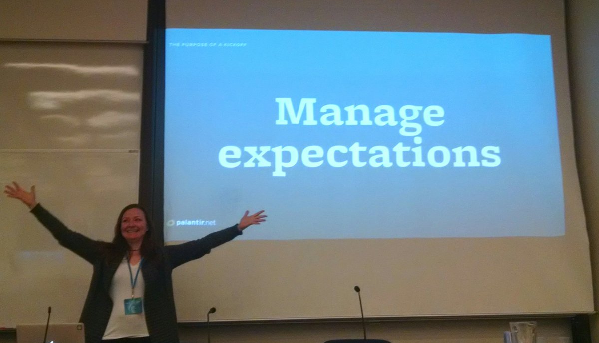 Alison Manley in front of a screen that says Manage Expectations