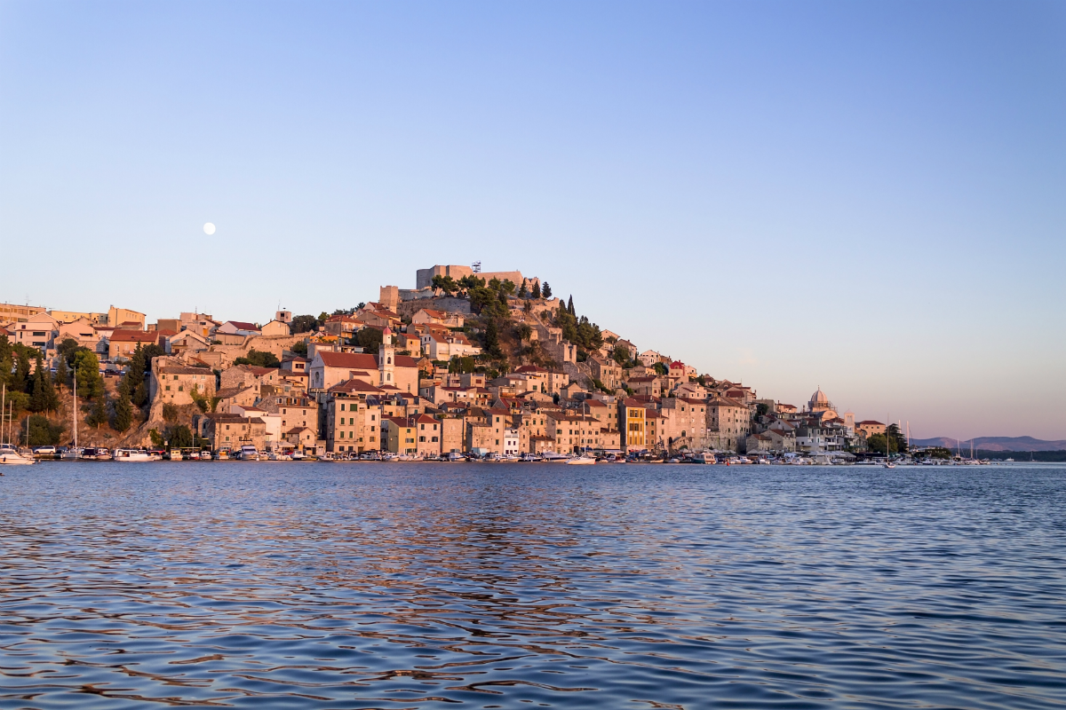 Šibenik is located in central Dalmatia where the river Krka flows into the Adriatic Sea. Enjoy the panorama of Šibenik in the evening.