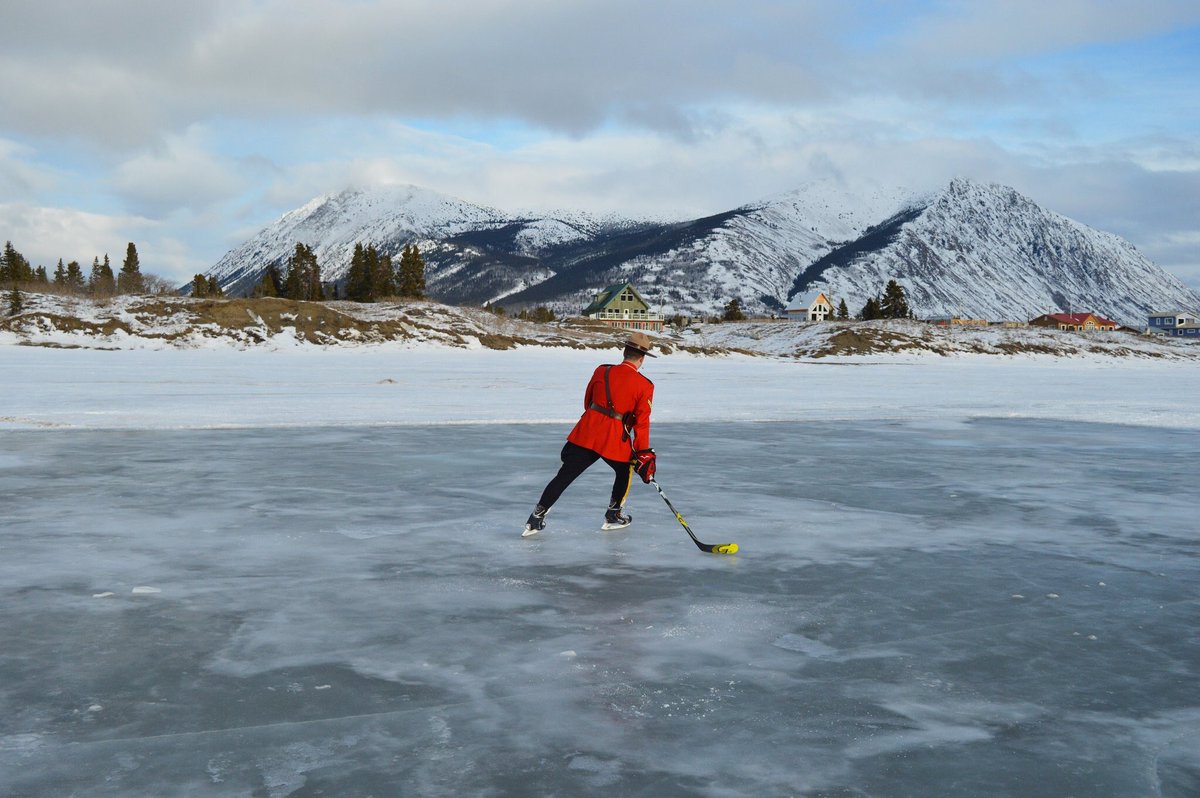 BrentToderian's tweet photo. The most Canadian picture ever? Kudos to #RCMP detachment, builds community rink on #BennettLake. HT @evaholland #Canada @rcmpgrcpolice https://t.co/wDYmM7le9y